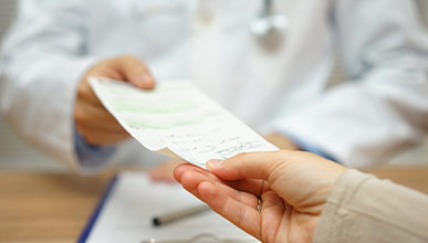 doctor handing patient prescription for benzodiazepines 