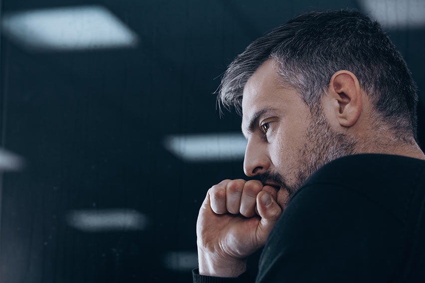 distraught man suffering from opioid withdrawal