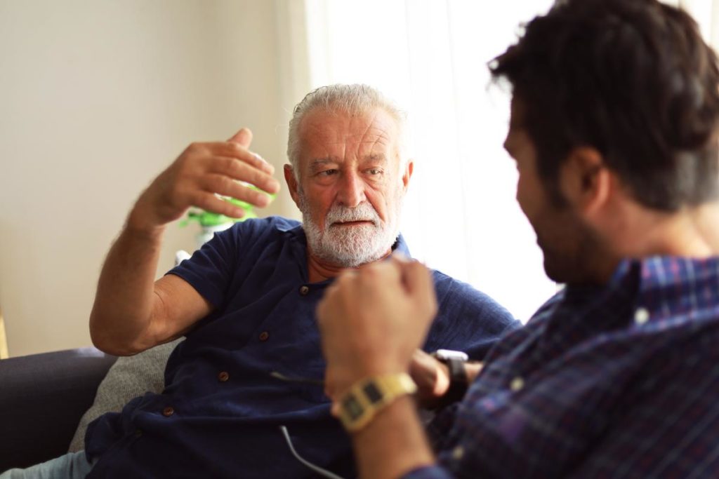 Two men discussing the benefits of behavioral therapy